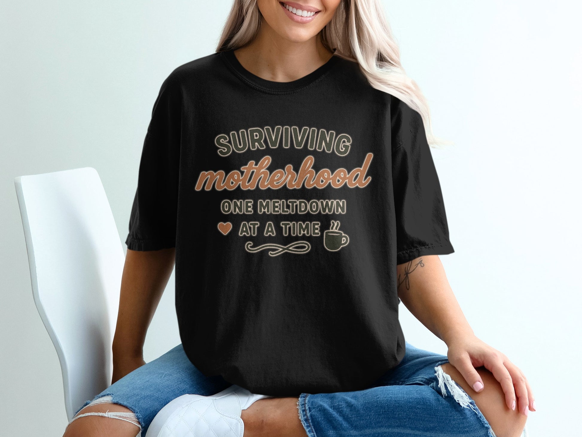 Black- Surviving Motherhood One Meltdown at a Time Shirt