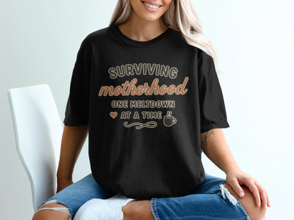 Black- Surviving Motherhood One Meltdown at a Time Shirt